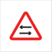 Sign: Two-way traffic crosses one-way road